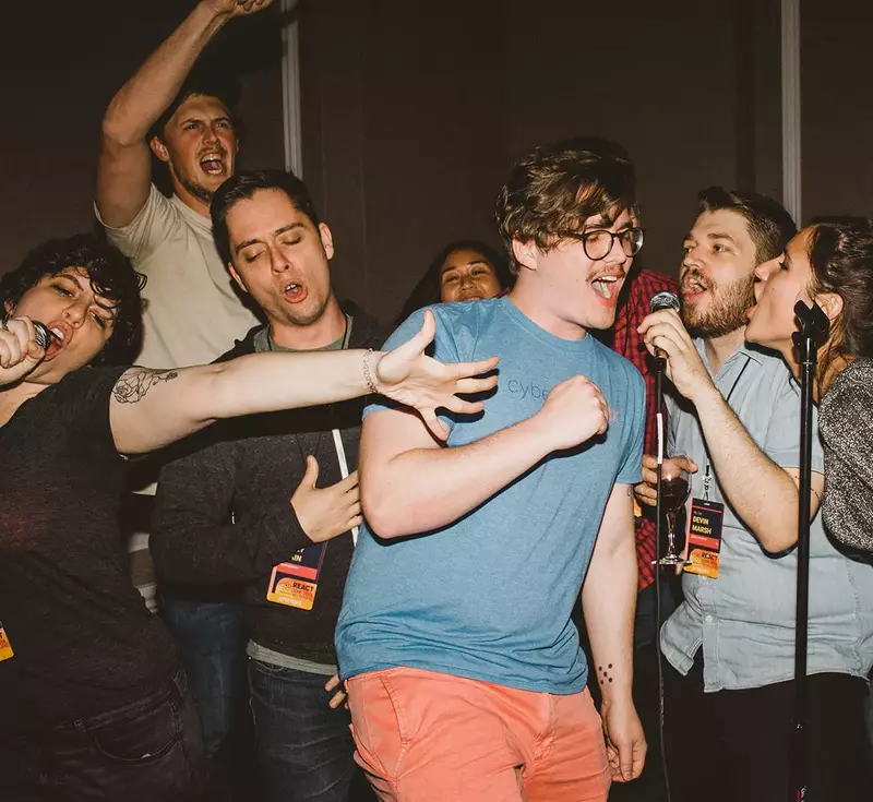 People singing karaoke at React Conf